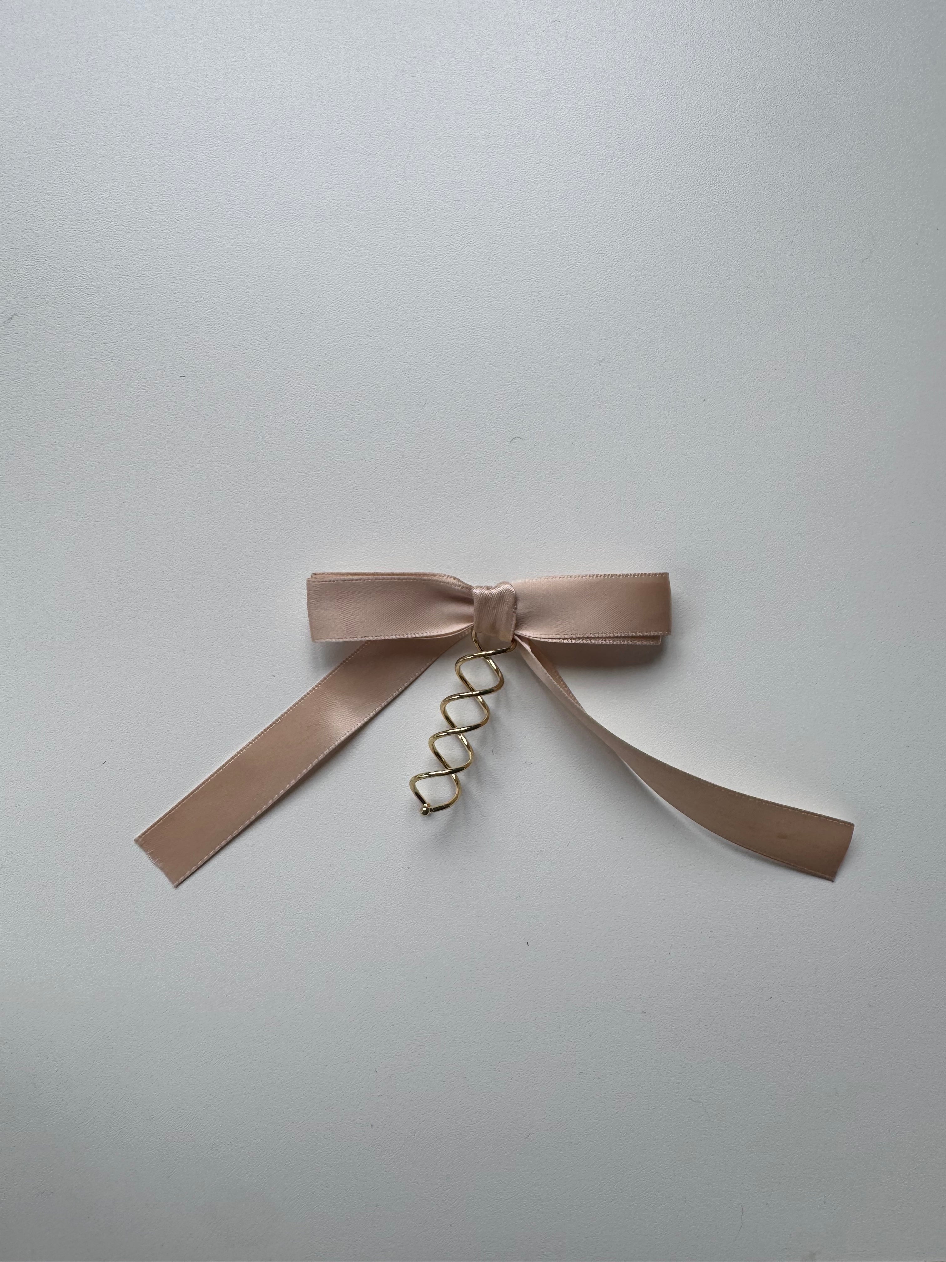 Échantillon - Boucle crème rosée sur spirale
