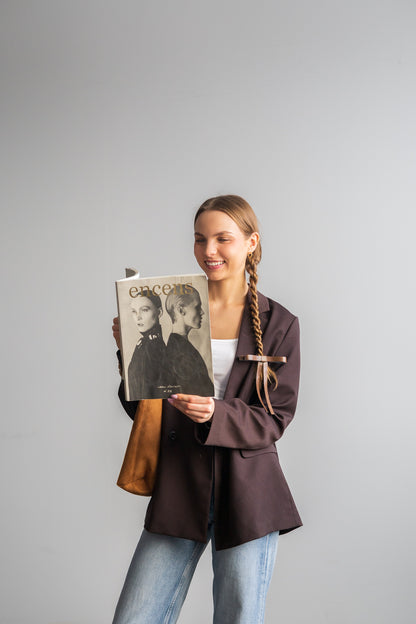 Boucle en similicuir sur barrette dorée