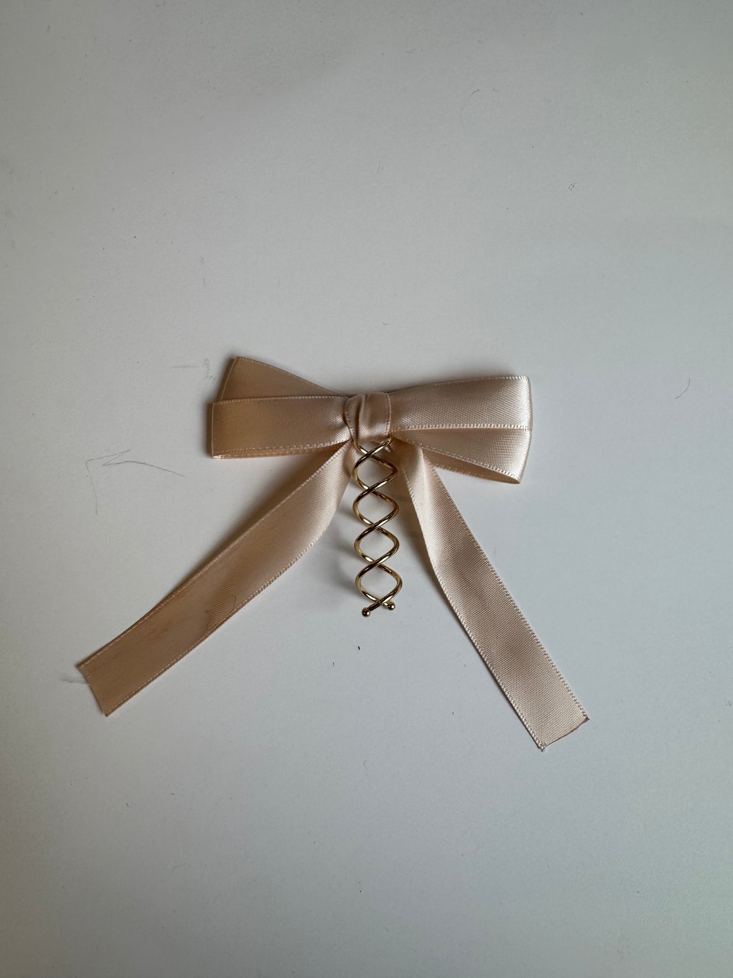 Imparfait - Boucle sur spirale en rosé