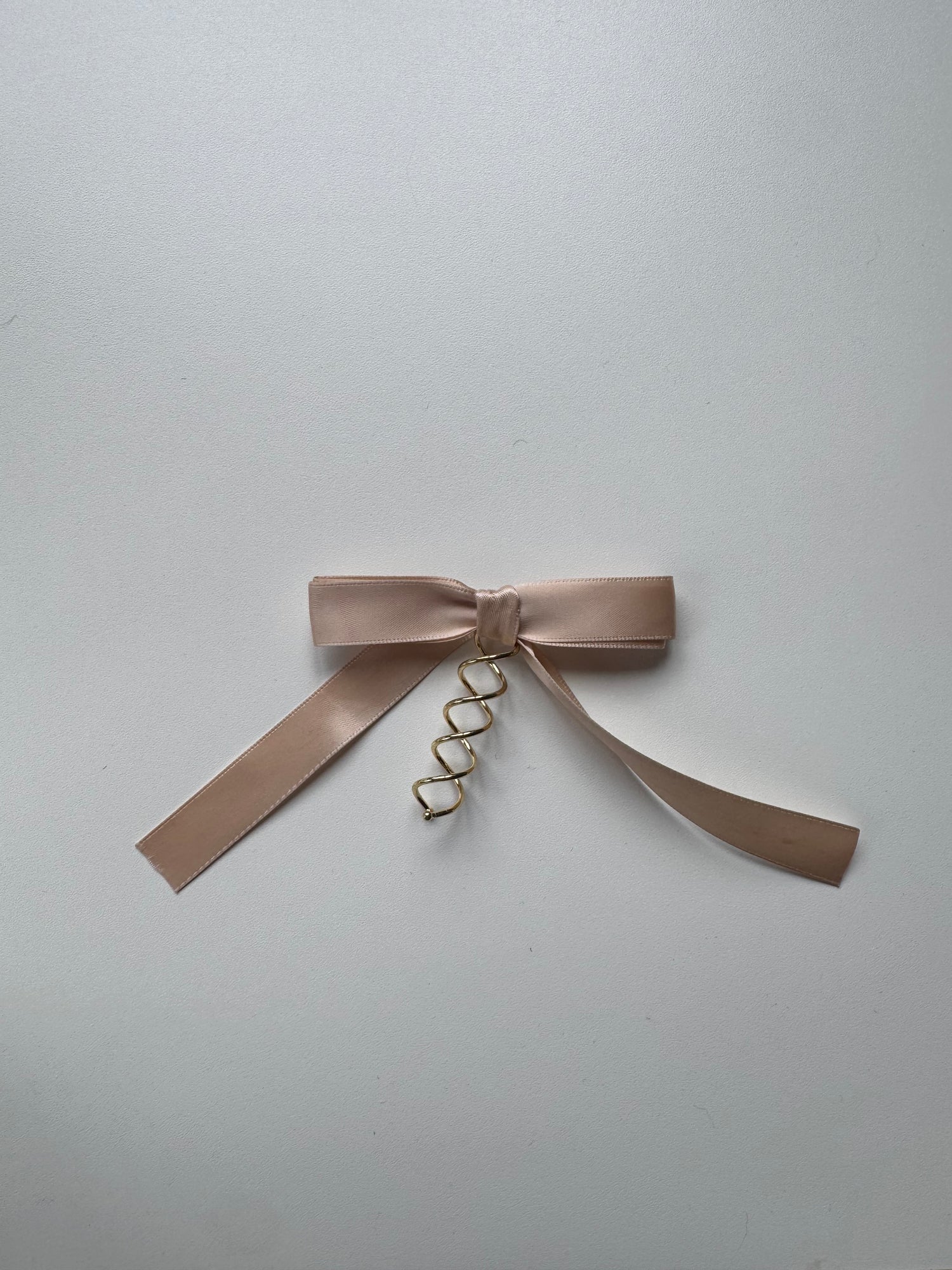 Échantillon - Boucle crème rosée sur spirale